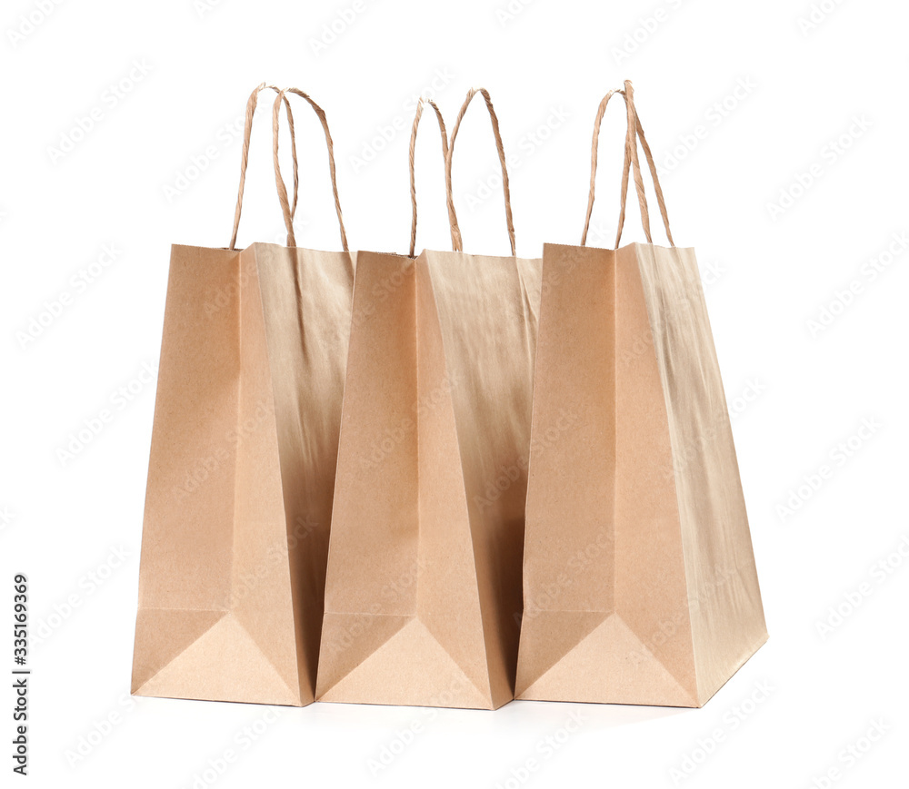 Paper shopping bags on white background