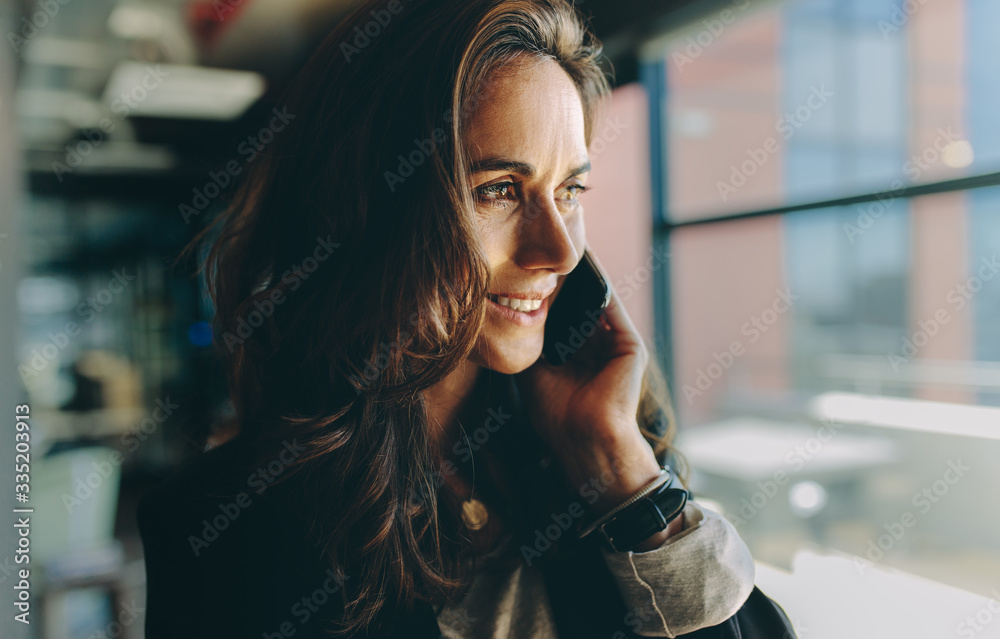 Smiling businesswoman on a phone call