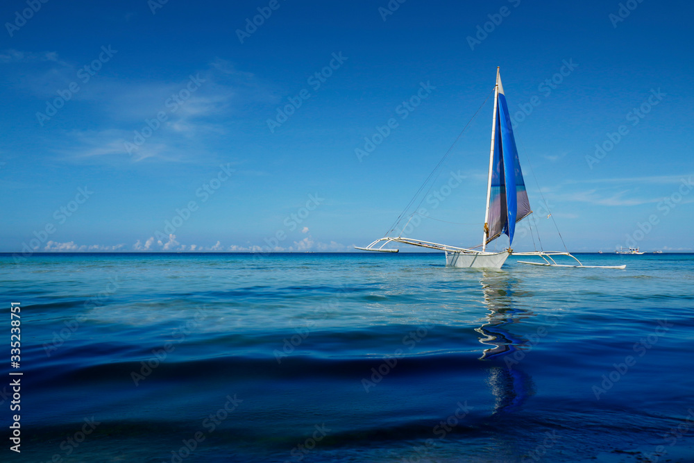 silhouette of boat on the beach  in philippines 