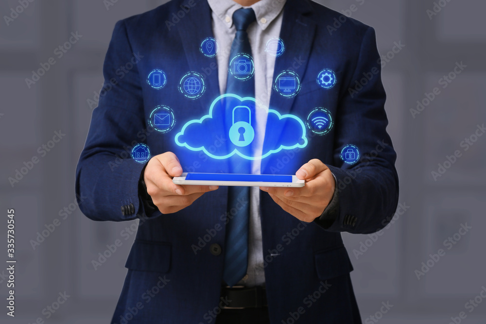 Businessman with tablet computer and hologram projection of cloud storage service, closeup