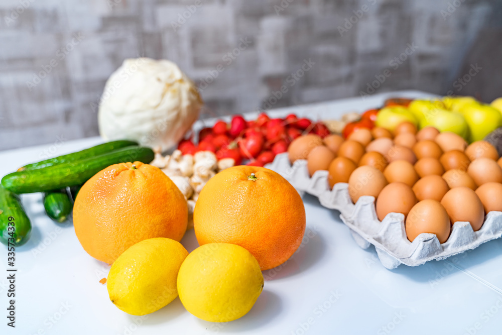 Paleo diet. Products on white table. View from above. Healthy dieting. Fresh tasty vegetables and fr