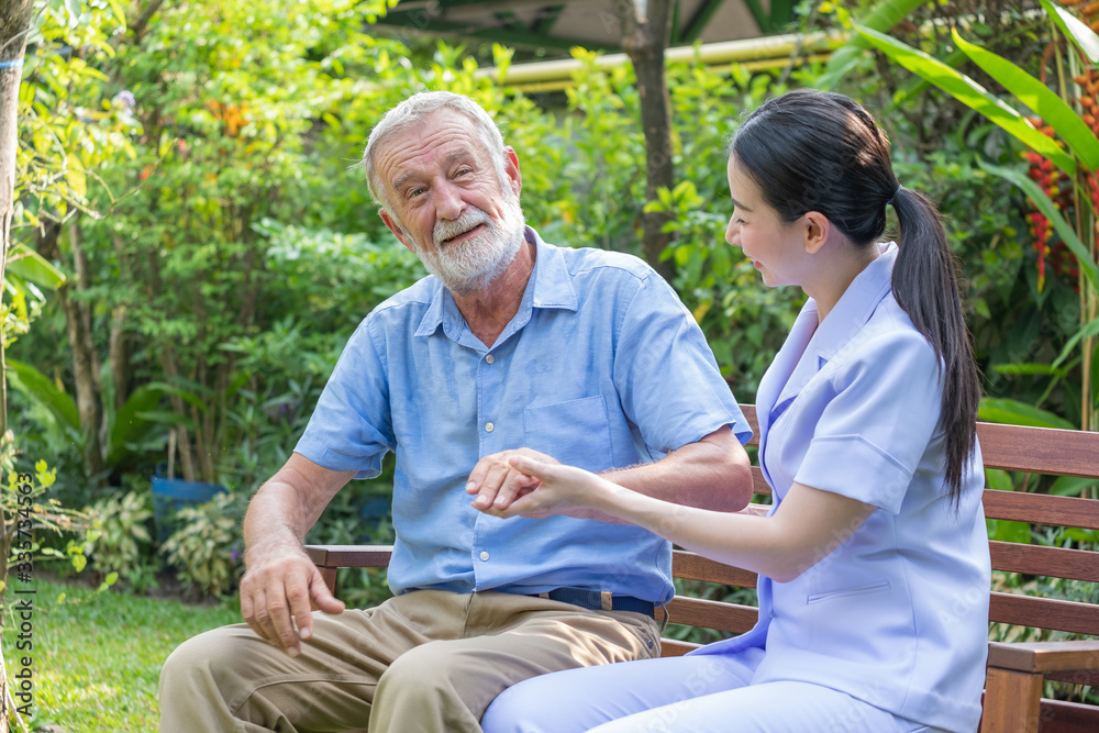 Young nurse take care senior man at home, Senior man happniess and smiling with nurse, Health care c