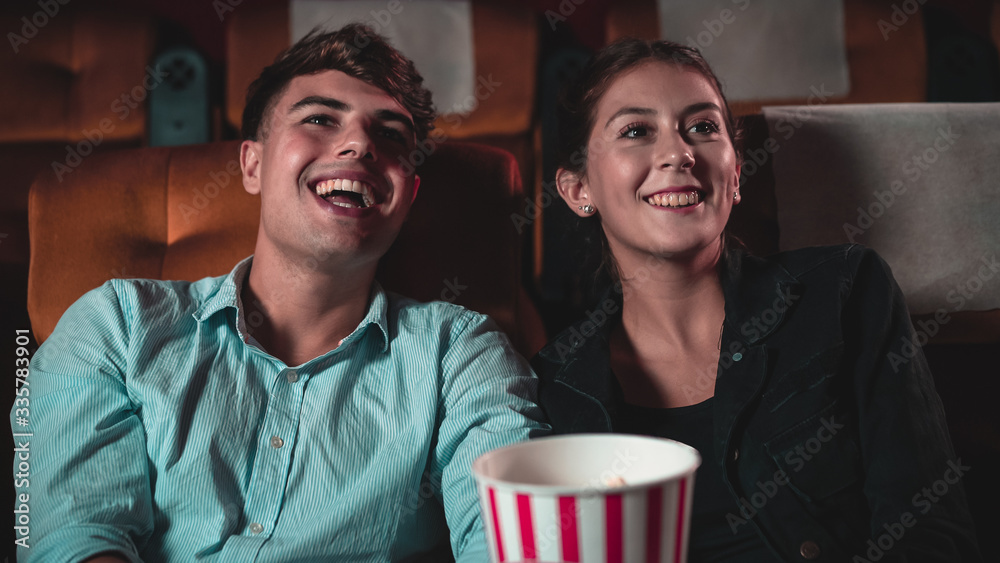 People audience watching movie in the movie theater cinema. Group recreation activity and entertainm