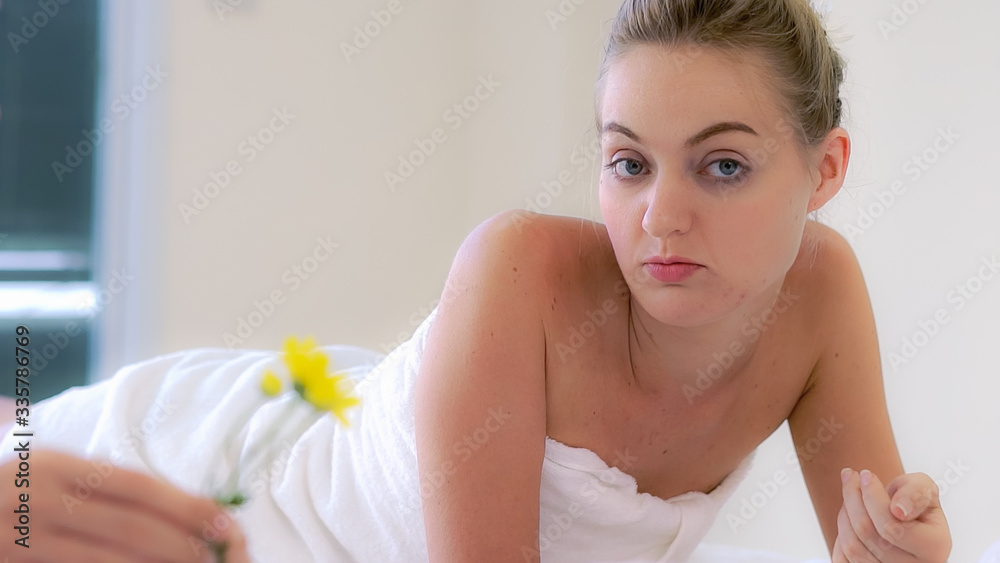 Two women at massage room having conversation in luxury day spa. Wellness, leisure and healthcare co