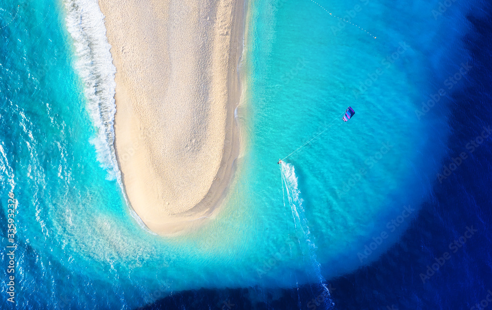 Aerial view on the beach and windsurfer. Beach and sea from air. Famous place in Croatia. Summer sea