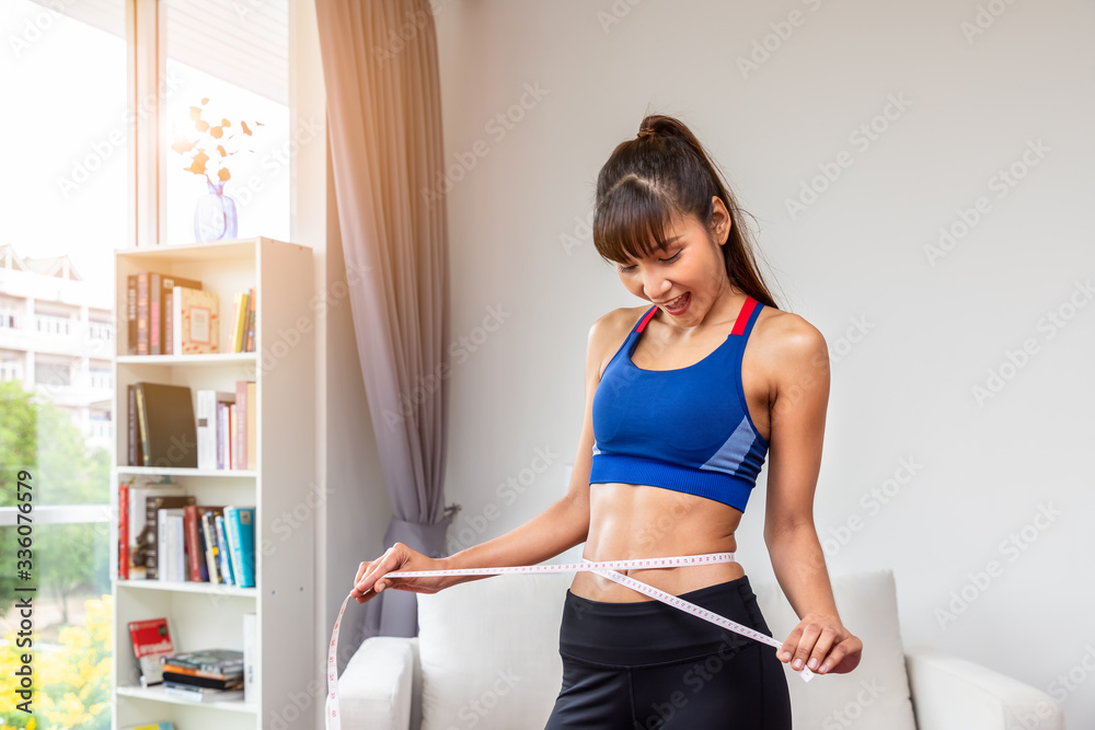 Attractive female woman torso with measuring tape, weight loss and dieting concept