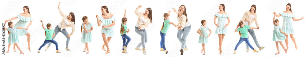 Happy mother and her little daughter dancing against white background