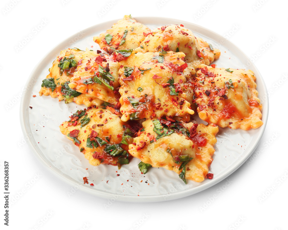 Plate with tasty ravioli on white background