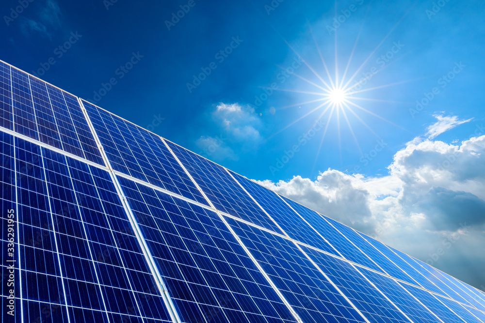 Photovoltaic solar power panel on sky background,green clean alternative energy concept.