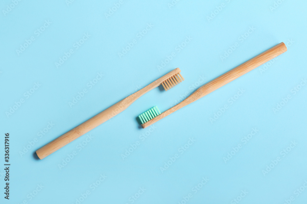 Wooden tooth brushes on color background