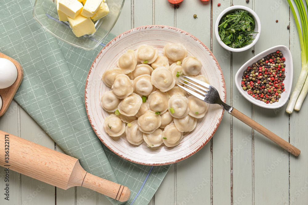 Plate with tasty dumplings on table