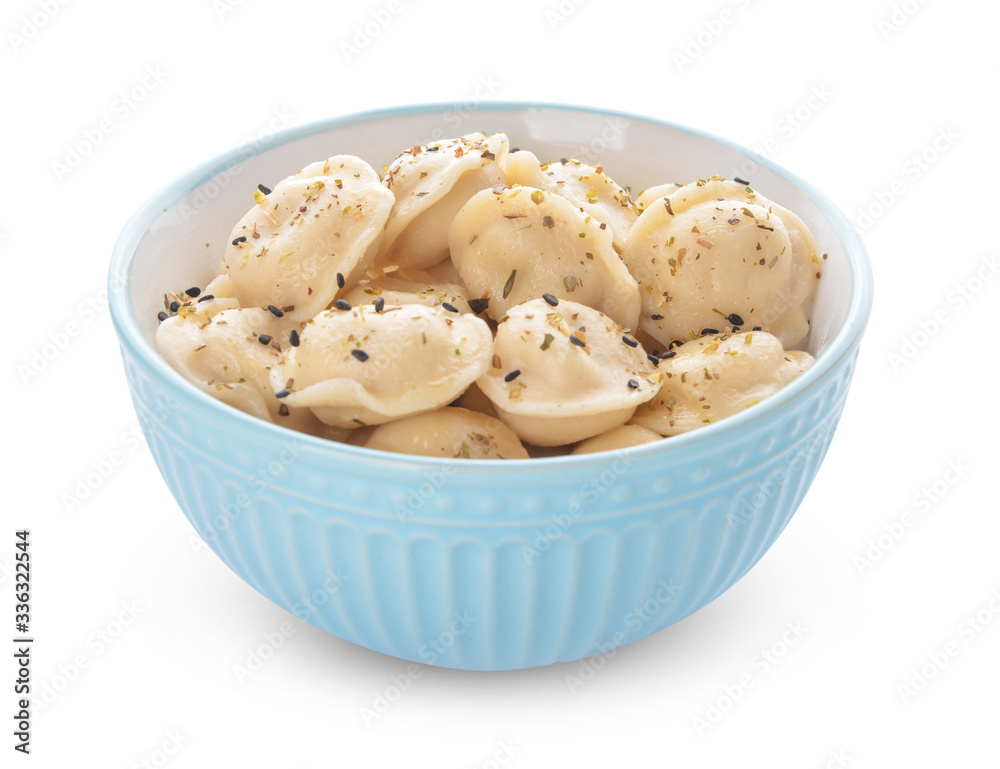 Bowl with tasty dumplings on white background