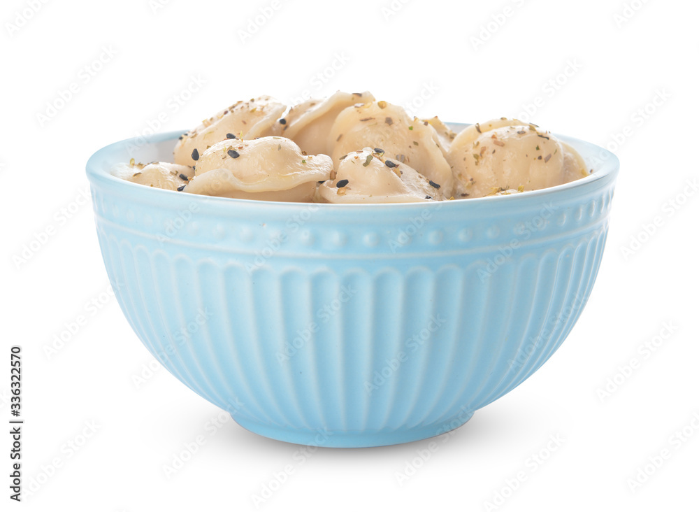 Bowl with tasty dumplings on white background