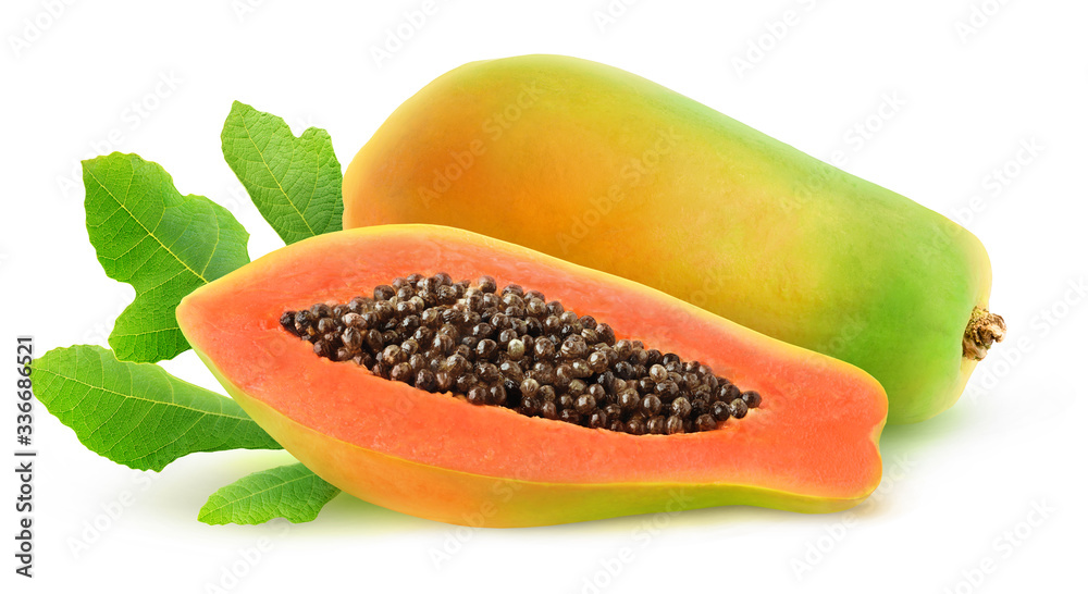 Isolated papaya. One fresh papaya fruit and a half over leaves isolated on white background