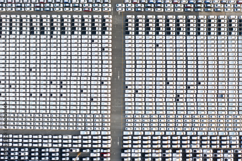 Top view of row new cars in logistic port export terminal.