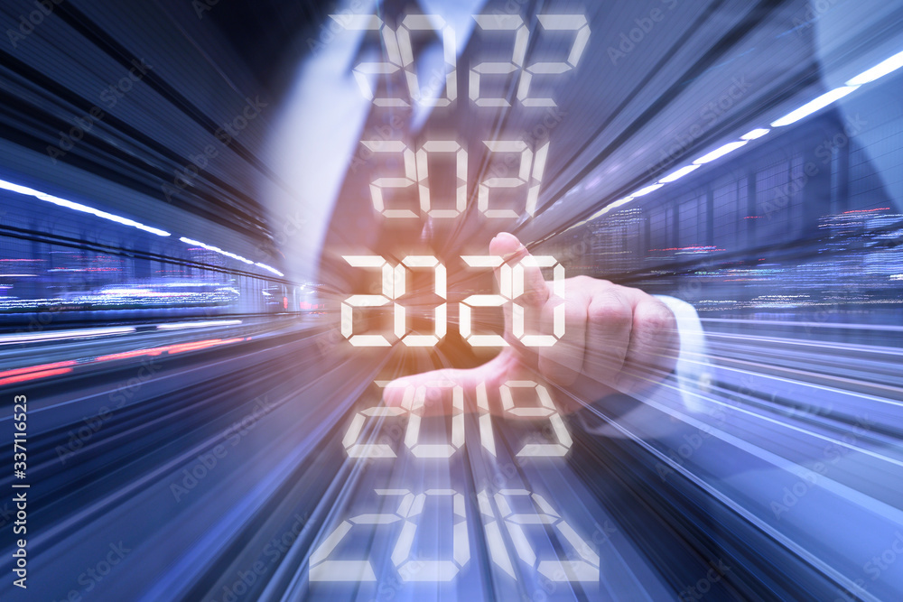 New year combined futuristic concept, Businessman pointing at year 2020