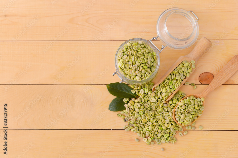 Green coffee beans on table