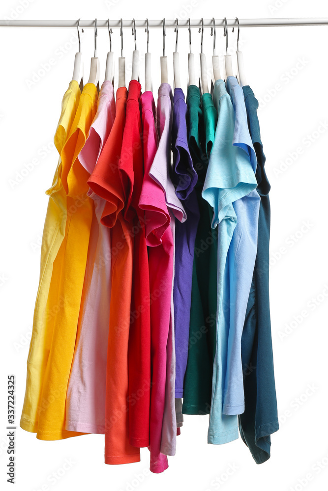 Rack with hanging clothes on white background