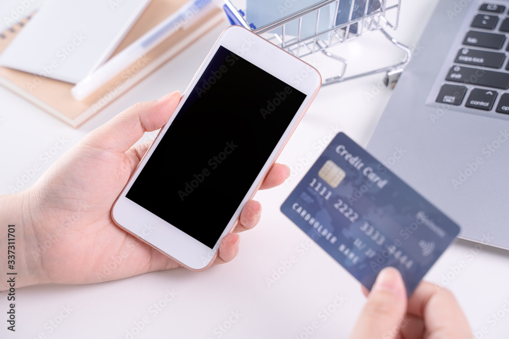 Woman holding smart mobile phone, concept of staying home online paying, electronic payment shopping