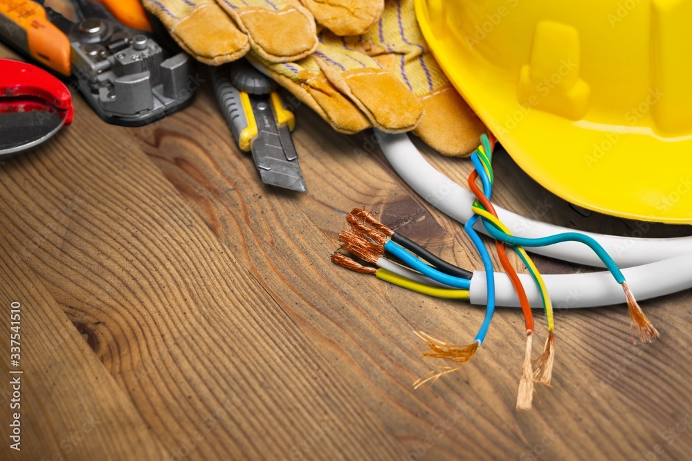 Yellow hard hat and leather work gloves