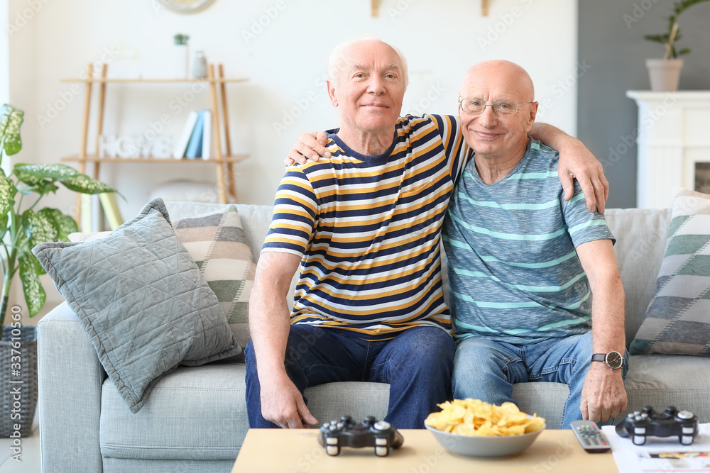 Elderly men resting together at home