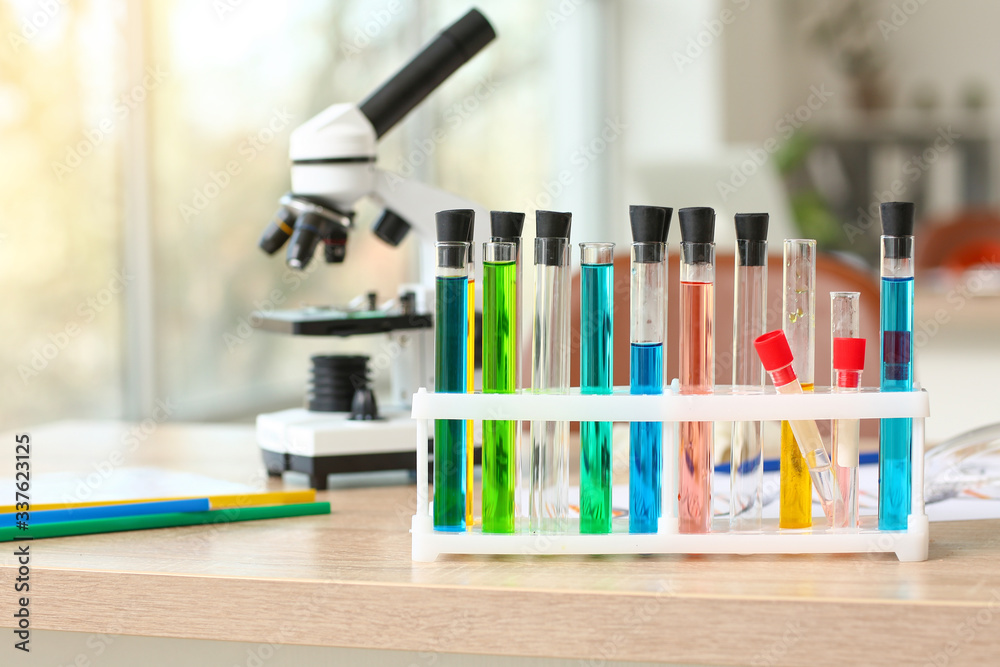 Laboratory glassware with samples on table in classroom