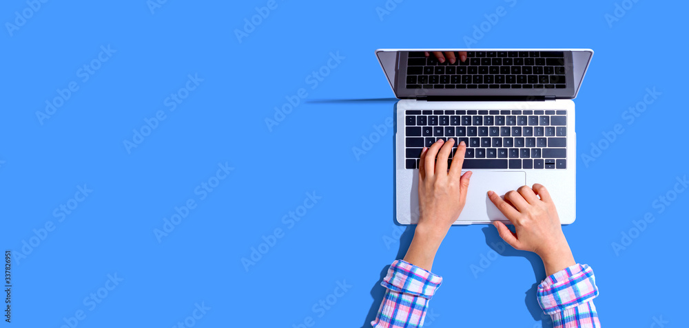 Person using a laptop computer from above