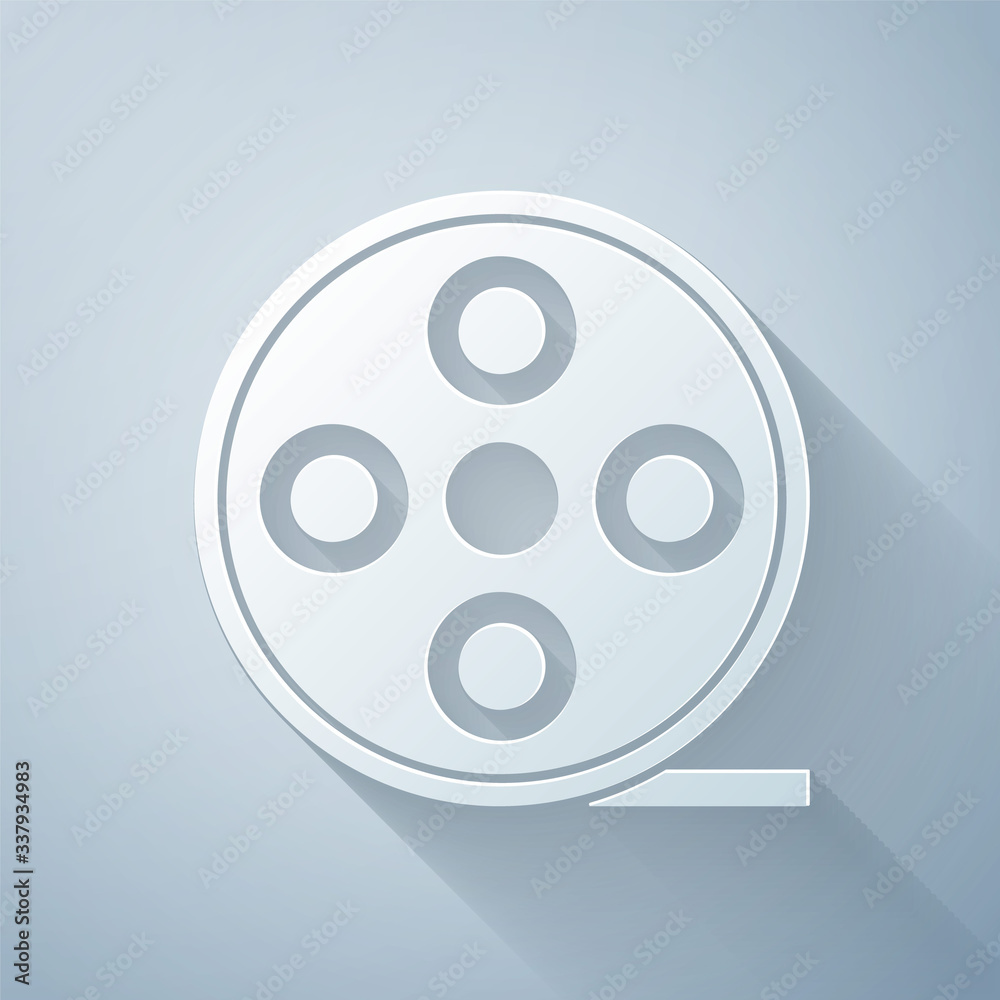 Paper cut Film reel icon isolated on grey background. Paper art style. Vector Illustration