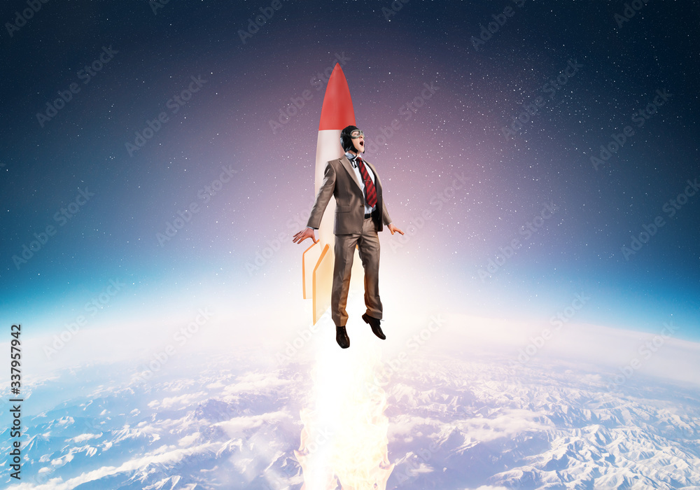 Business person in aviator hat flying on rocket