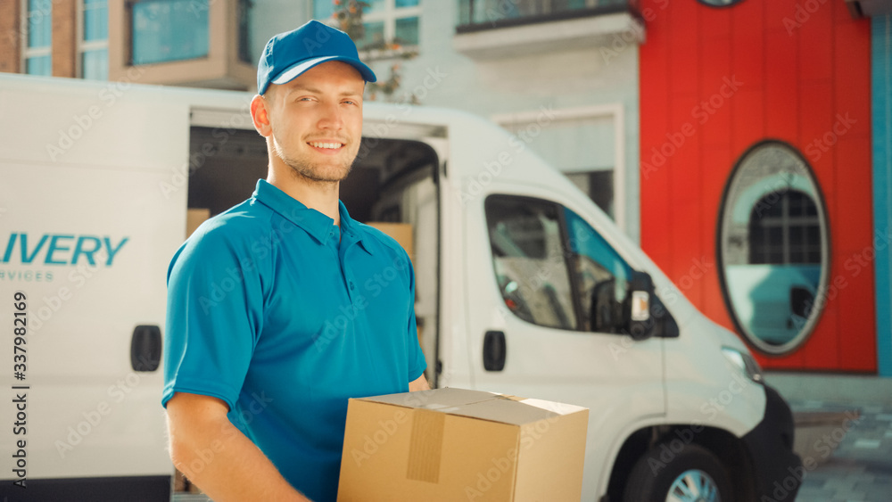 Handsome Courier Takes Cardboard Box Package out of Delivery Van Walks Through Modern Stylish Busine