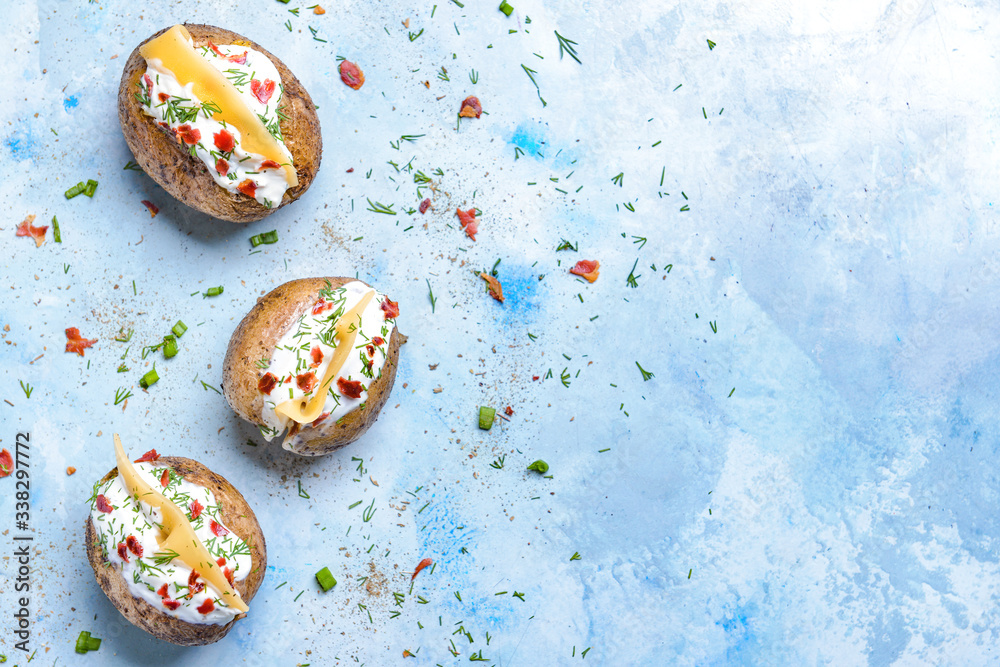 Tasty baked potato with sour cream on color background