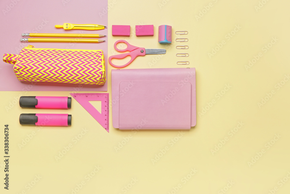 Pencil bag with stationery on color background