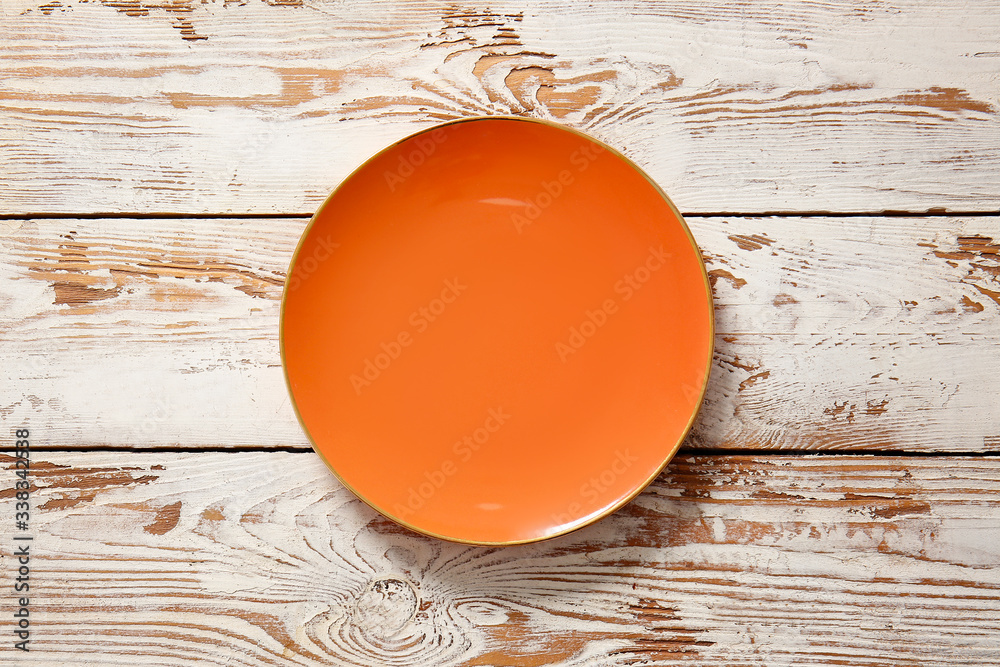 Clean plate on wooden background