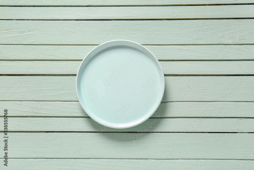 Clean plate on wooden background