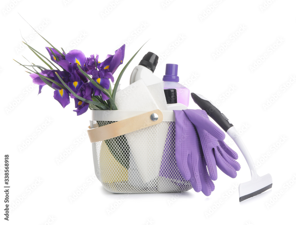 Set of cleaning supplies and spring flowers on white background