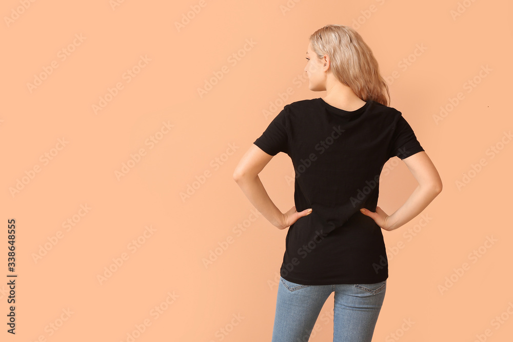 Woman in stylish t-shirt on color background