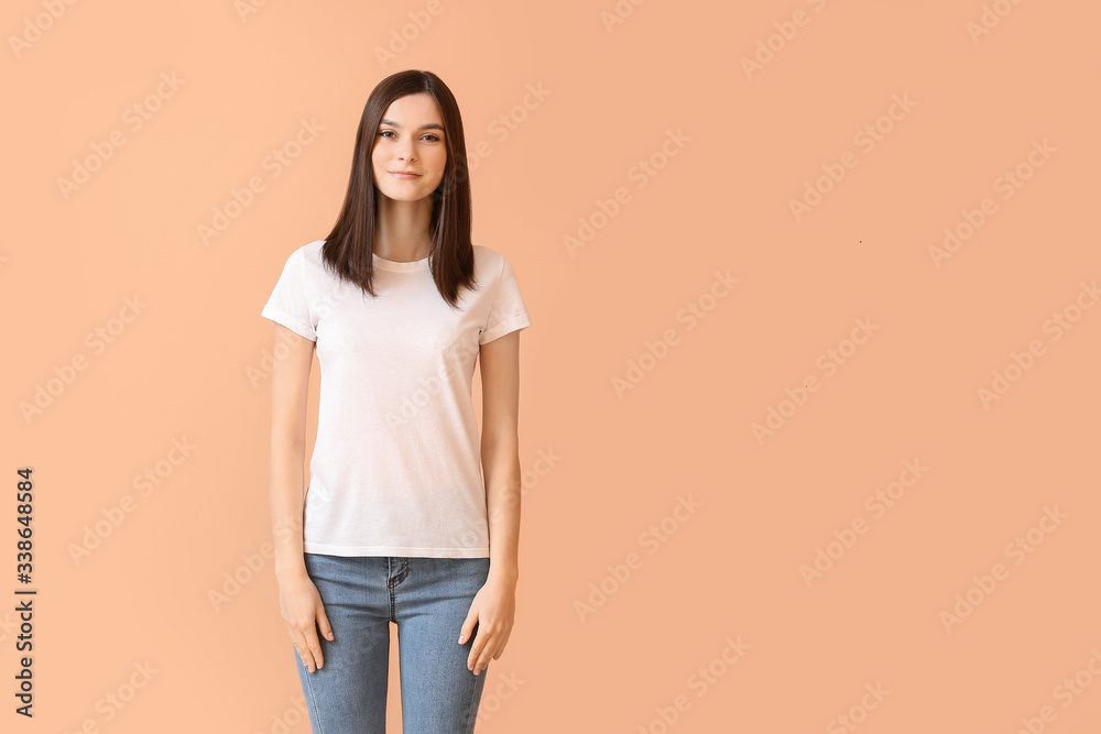 Woman in stylish t-shirt on color background