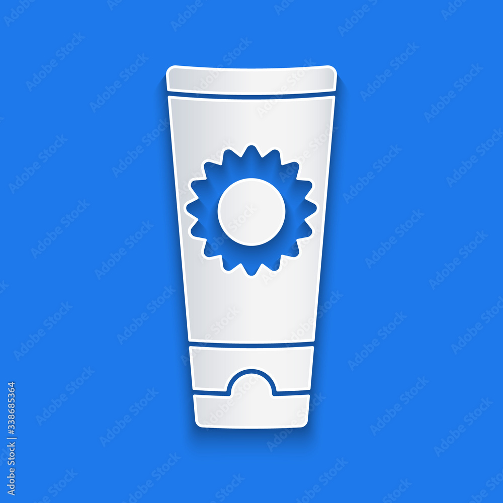 Paper cut Sunscreen cream in tube icon isolated on blue background. Protection for the skin from sol