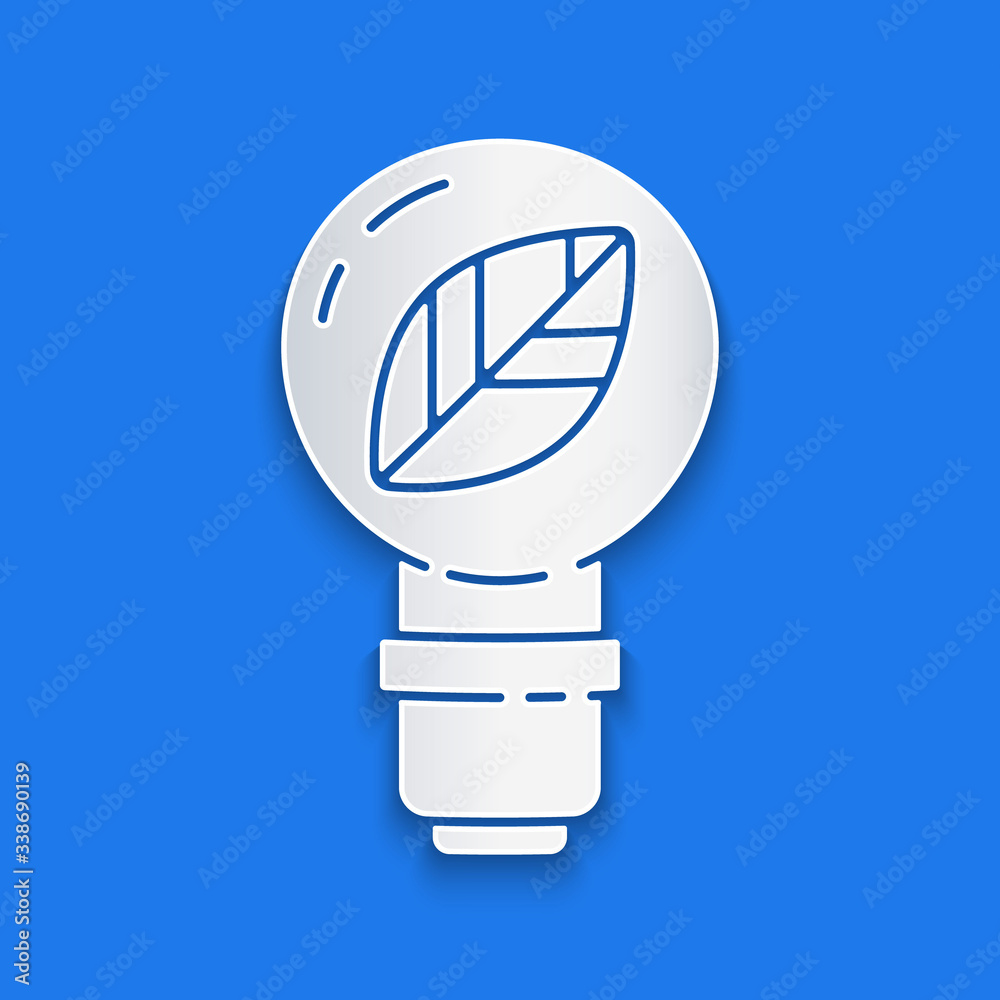 Paper cut Light bulb with leaf icon isolated on blue background. Eco energy concept. Alternative ene