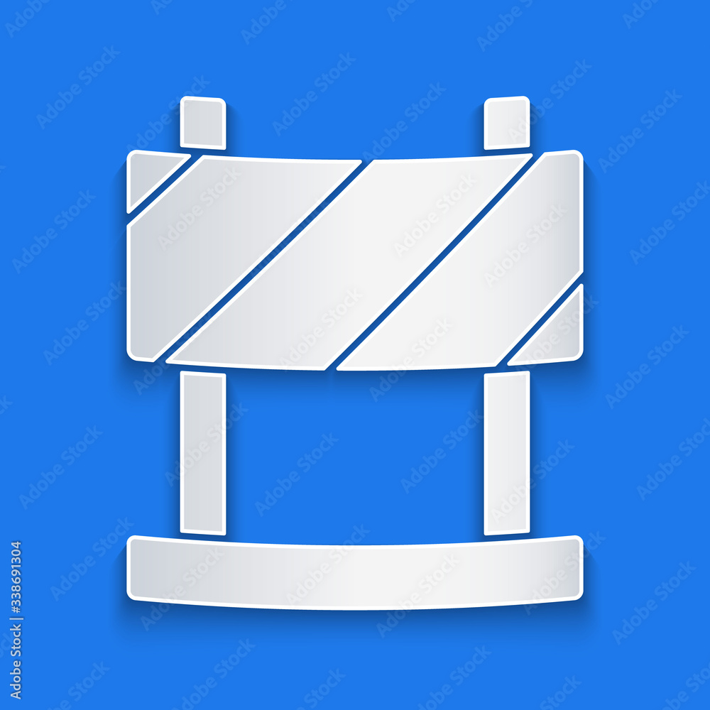 Paper cut Road barrier icon isolated on blue background. Symbol of restricted area which are in unde