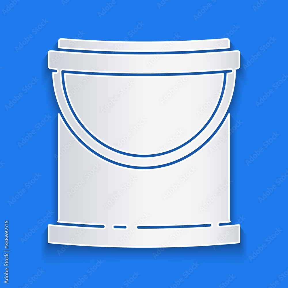 Paper cut Paint bucket icon isolated on blue background. Paper art style. Vector Illustration