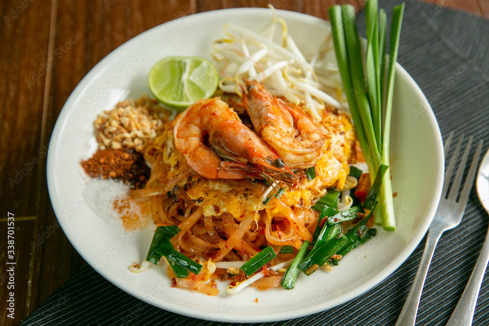 Pad Thai placed on a wooden table