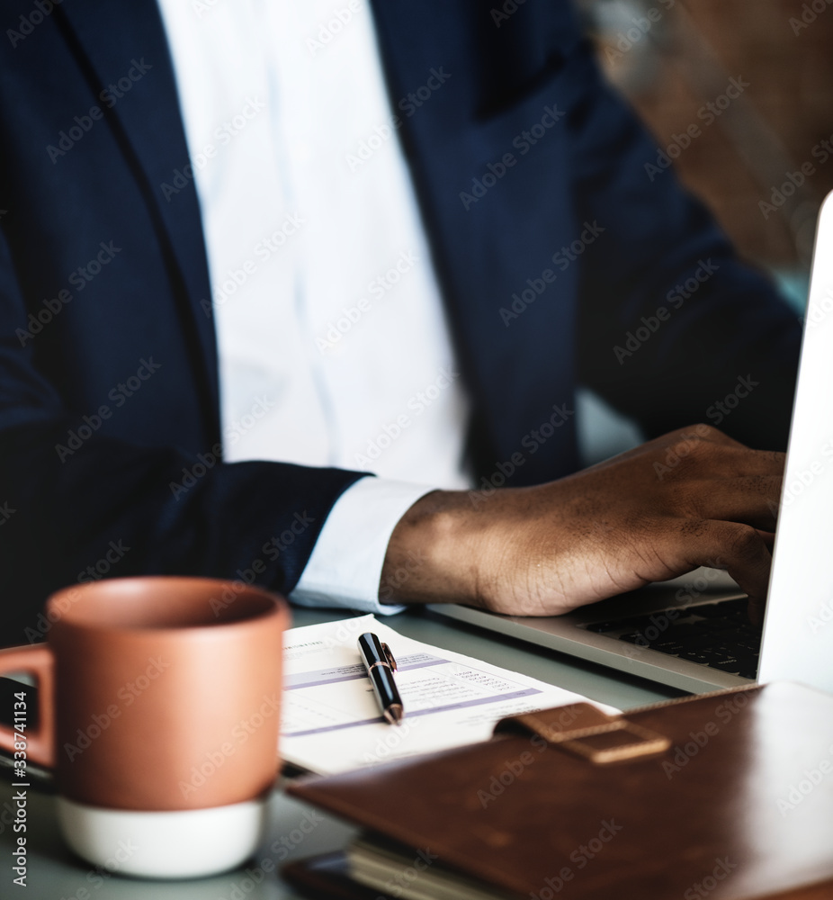 Black businessman using computer laptop