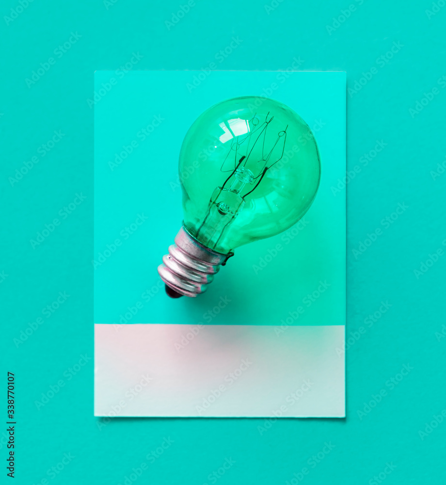 Colorful light bulb on a paper