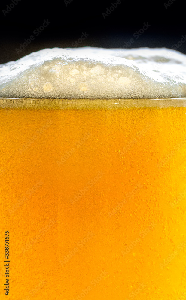 A glass of cold beer macro photography