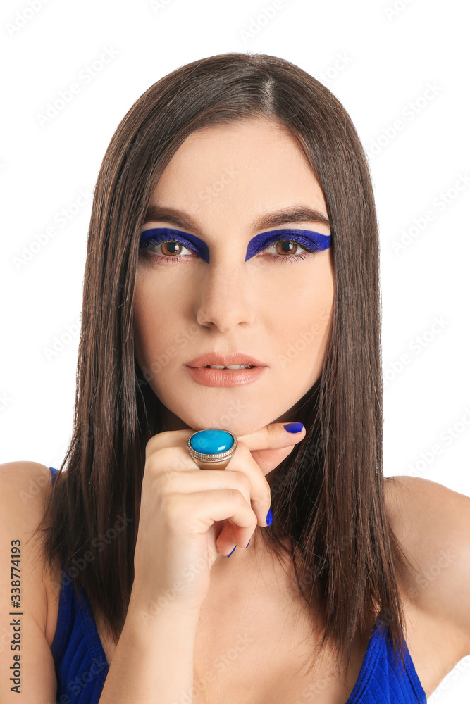 Portrait of fashionable young woman on white background