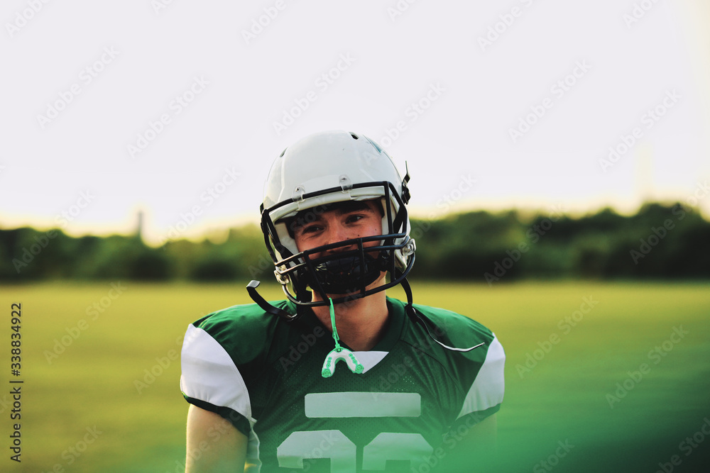 American football player standing on a field during practice