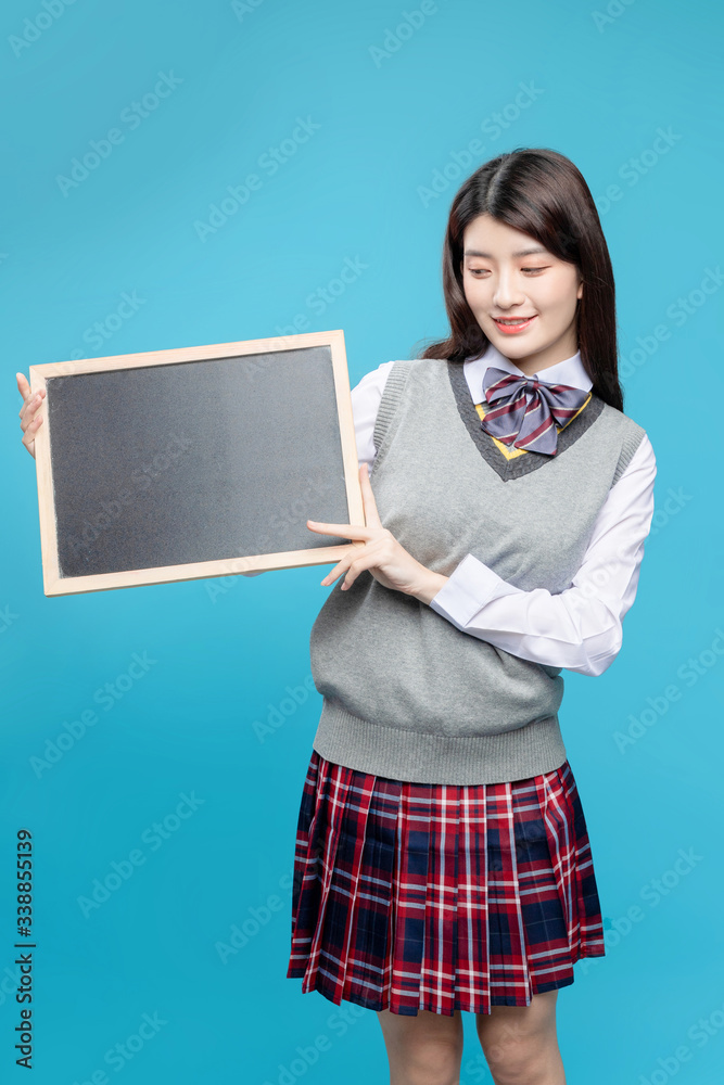 Asian schoolgirls on blue background