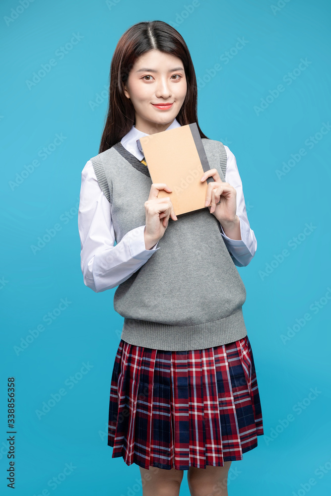 Asian schoolgirls on blue background