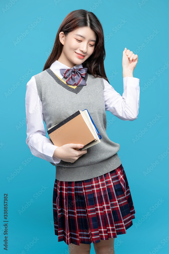 Asian schoolgirls on blue background